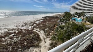 A beachfront hotel with a pool, beach access, and a view of the ocean. - Gulf Front Condo with Stunning Views! (Pensacola)