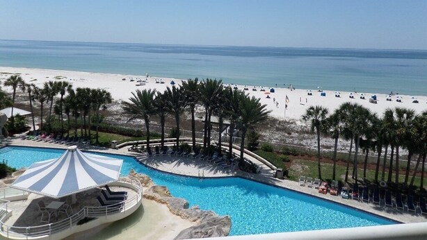 A resort pool with a view of the beach and ocean. - Gulf Front Condo with Stunning Views! (Pensacola)