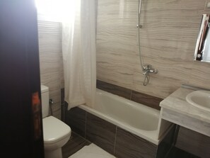 Hair dryer, towels, shampoo, toilet paper