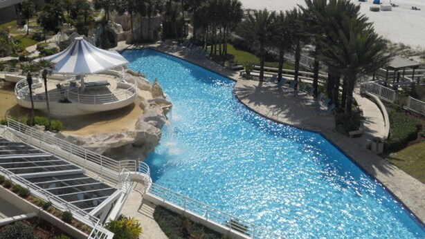 A resort pool with a view of the beach and ocean. - Gulf Front Condo with Stunning Views! (Pensacola)