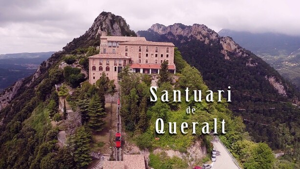 A historic building with a prominent bell tower, surrounded by lush greenery and mountains. - Charming house located in the Espinalbet area. (Castellar del Riu)