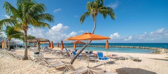 Cayman Islands Famous Seven Mile Beach Oceanfront  Sunset Cove #104 corner  unit