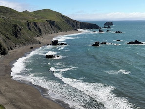 On the beach, sun loungers, beach towels