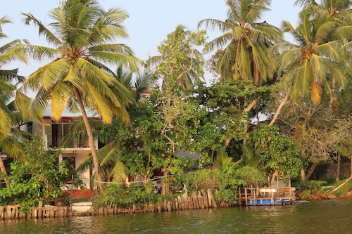 This  Riverside Villa perfect for Relaxation.