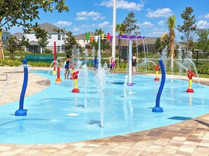 A water play area with multiple water jets and a tiled floor. - Kissimmee Condo: Pools, parks, family fun, and attractions! (Kissimmee)