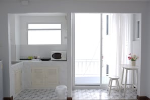 Standard Triple Room | Desk, laptop workspace, blackout drapes