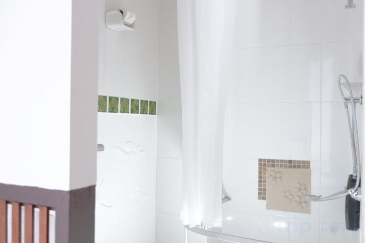 Bathroom | Shower, free toiletries, hair dryer, slippers