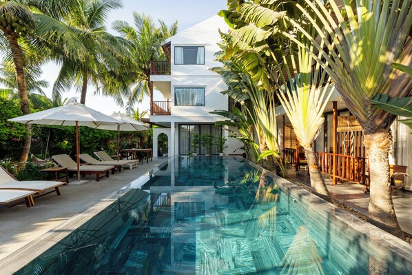 Outdoor pool, open 7:00 AM to 10:00 PM, pool umbrellas, pool loungers