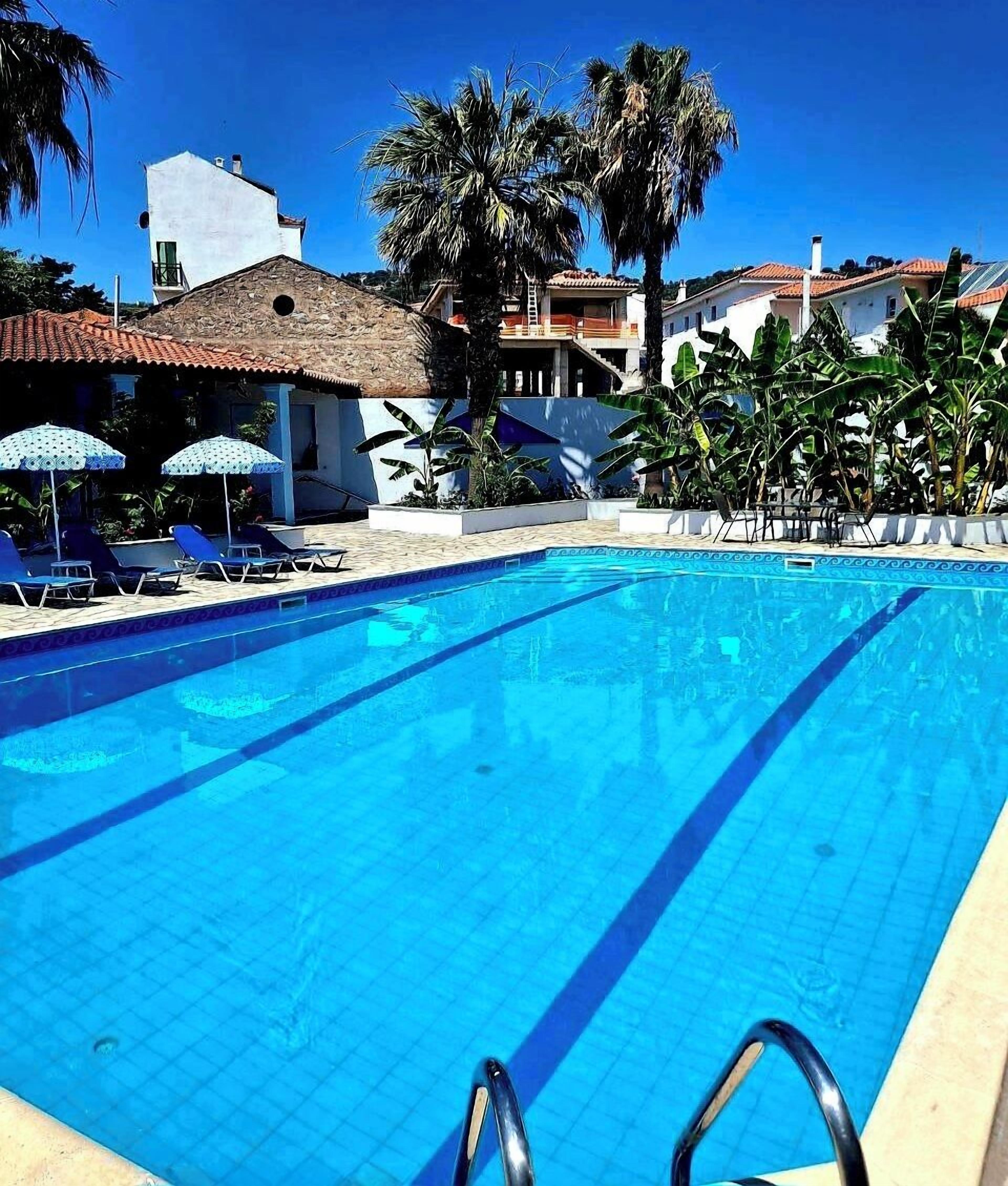 Seasonal outdoor pool, pool umbrellas, pool loungers