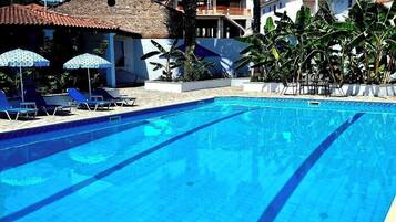 Seasonal outdoor pool, pool umbrellas, pool loungers