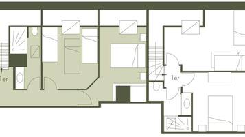 Un plano de planta que muestra varias habitaciones, incluyendo un baño, cocina y zonas de estar.
