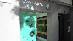 The entrance to a hostel with a teal-colored door and a sign reading "EASY SANTS HOSTAL". - Easy Sants by Bossh Hotels (Barcelona)