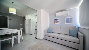 Studio, 3 Bedrooms | Living area | Flat-screen TV