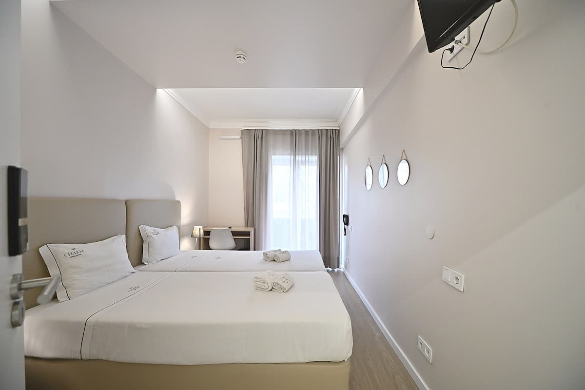 Twin Room, Shared Bathroom | 1 bedroom, in-room safe, blackout curtains, soundproofing