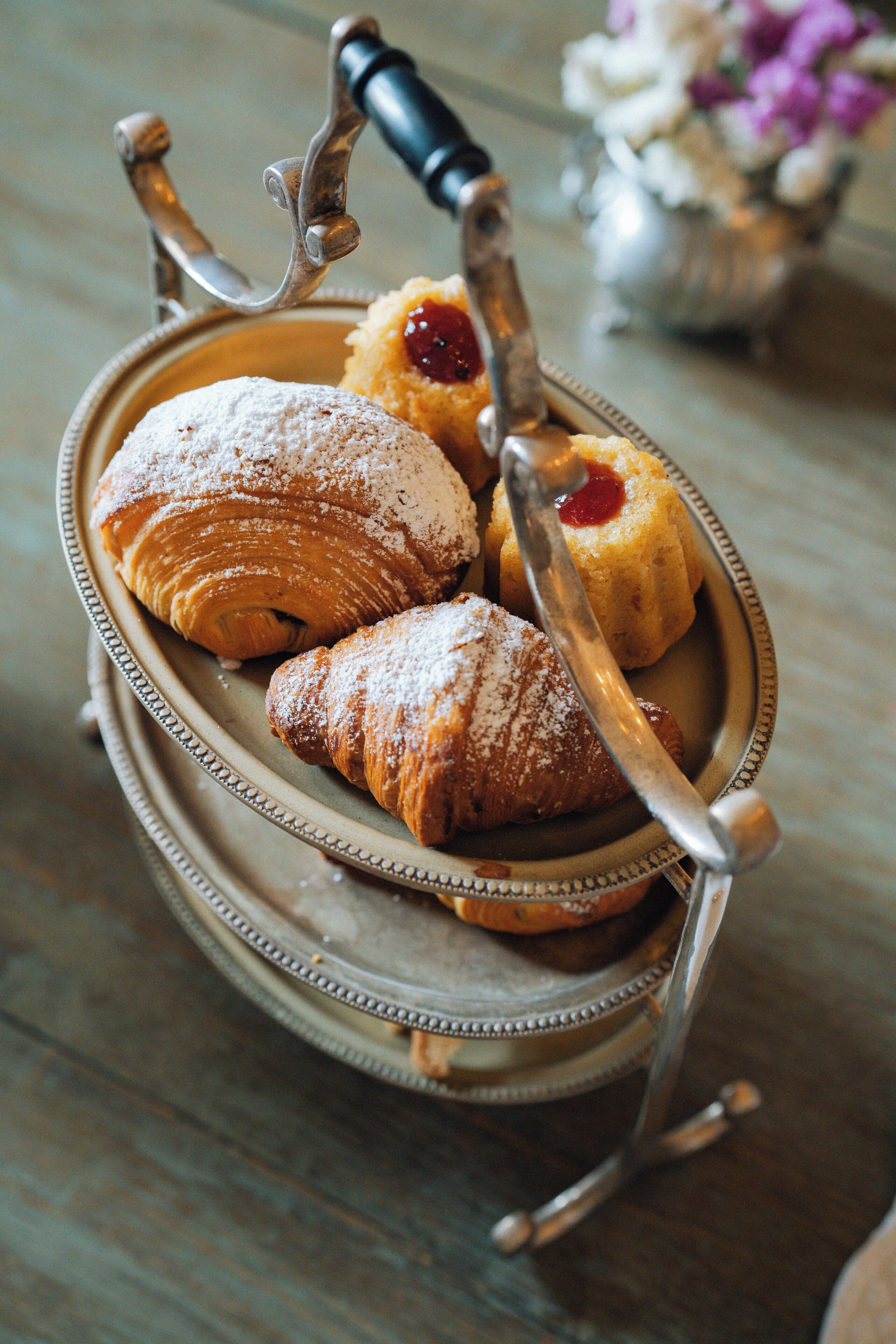 A tray with pastries and a vintage fork.