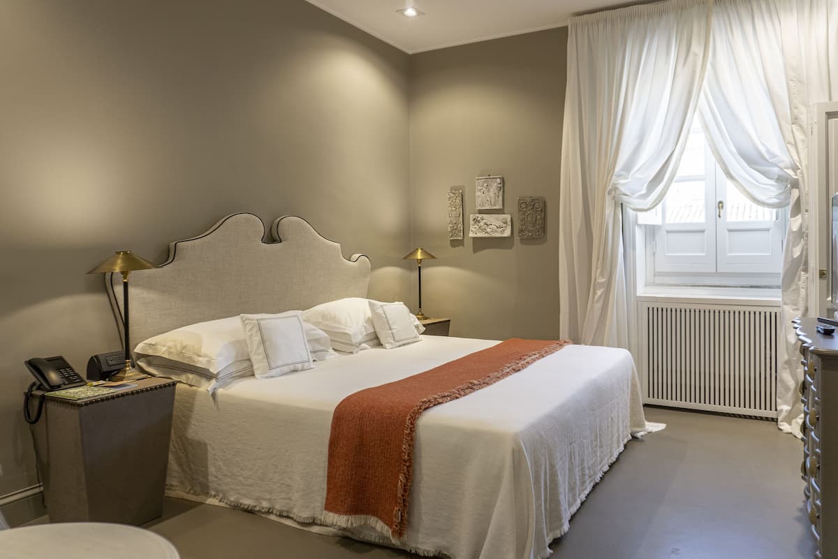Premium bedding, down duvets, memory-foam beds, free minibar items