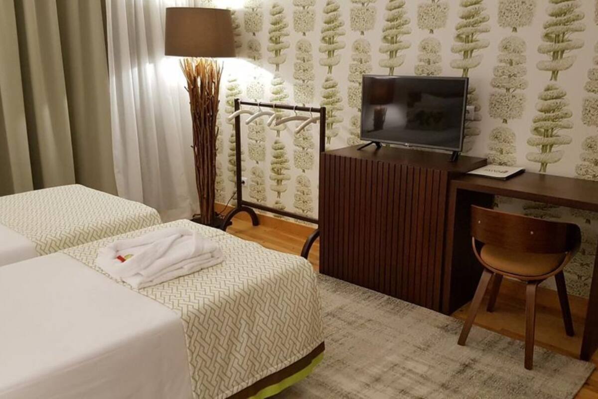 Twin Room, Garden View | Minibar, desk, blackout curtains, soundproofing