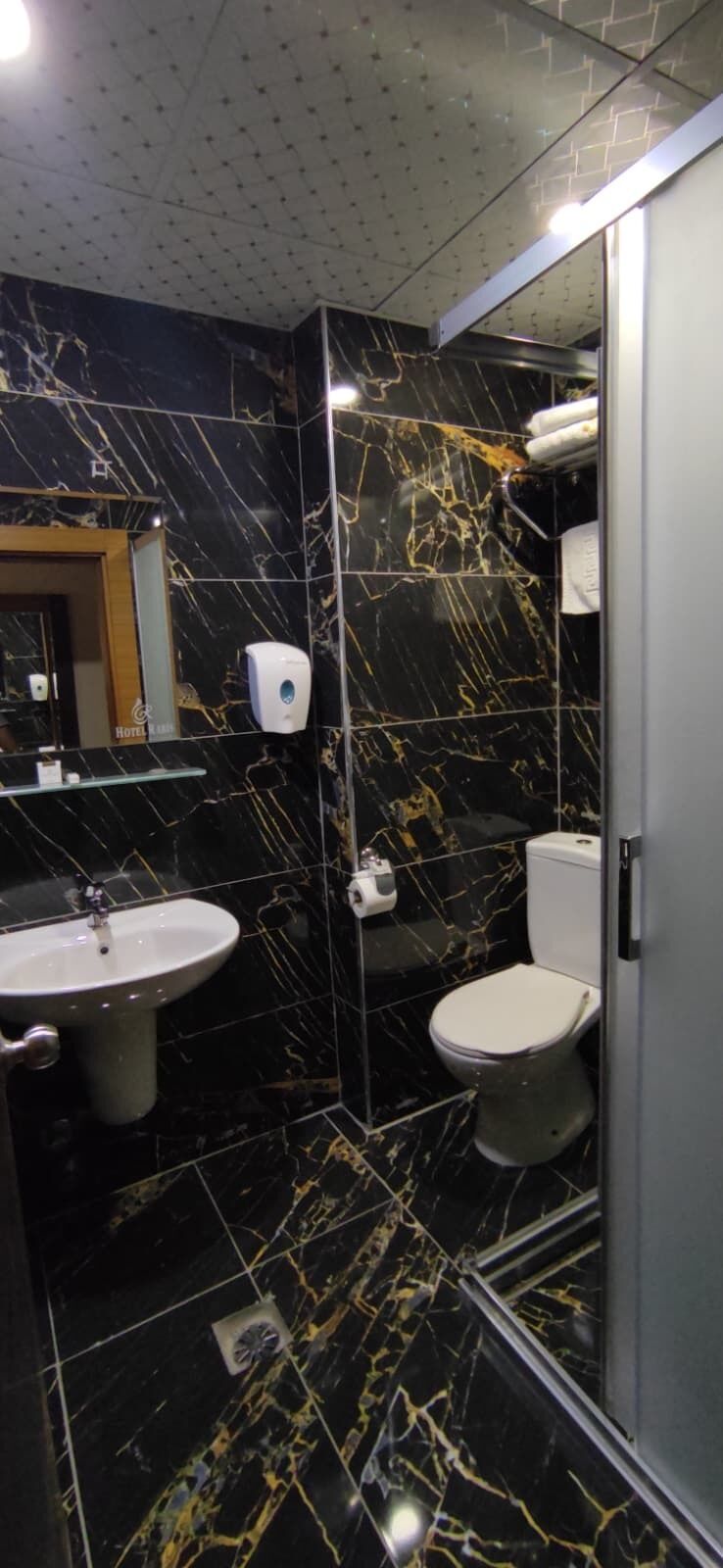 Shower, free toiletries, hair dryer, slippers