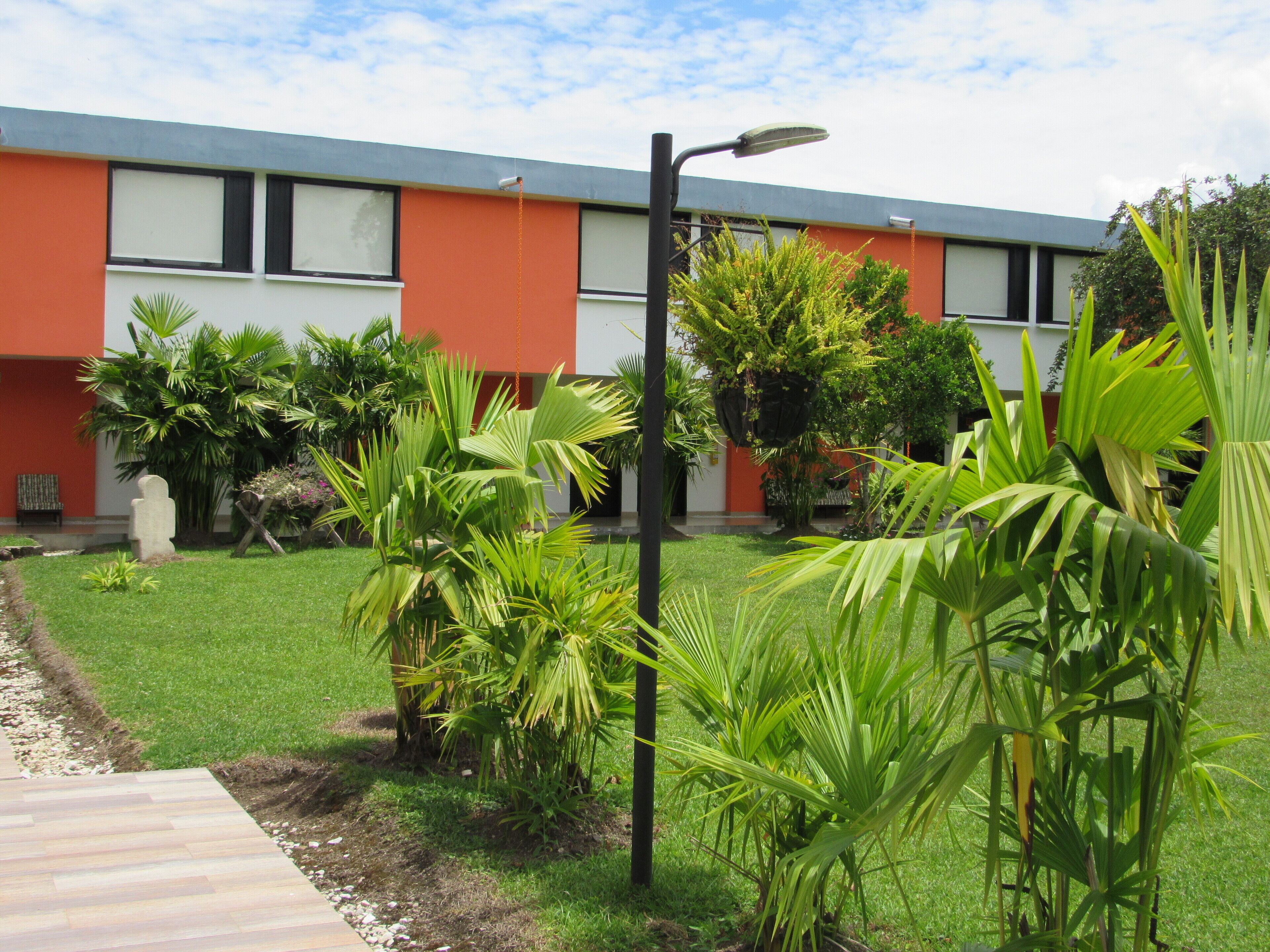 A building with a modern design, featuring a flat roof and large windows.