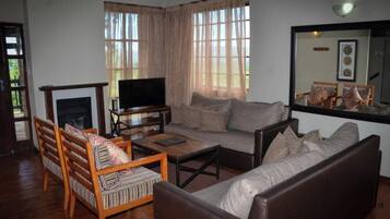 Basic Condo | Living area | 32-inch plasma TV with cable channels
