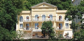 A building with a classical facade, multiple balconies, and a sign reading "Villa Rosa Pension." - Pension Villa Rosa (Karlovy Vary)