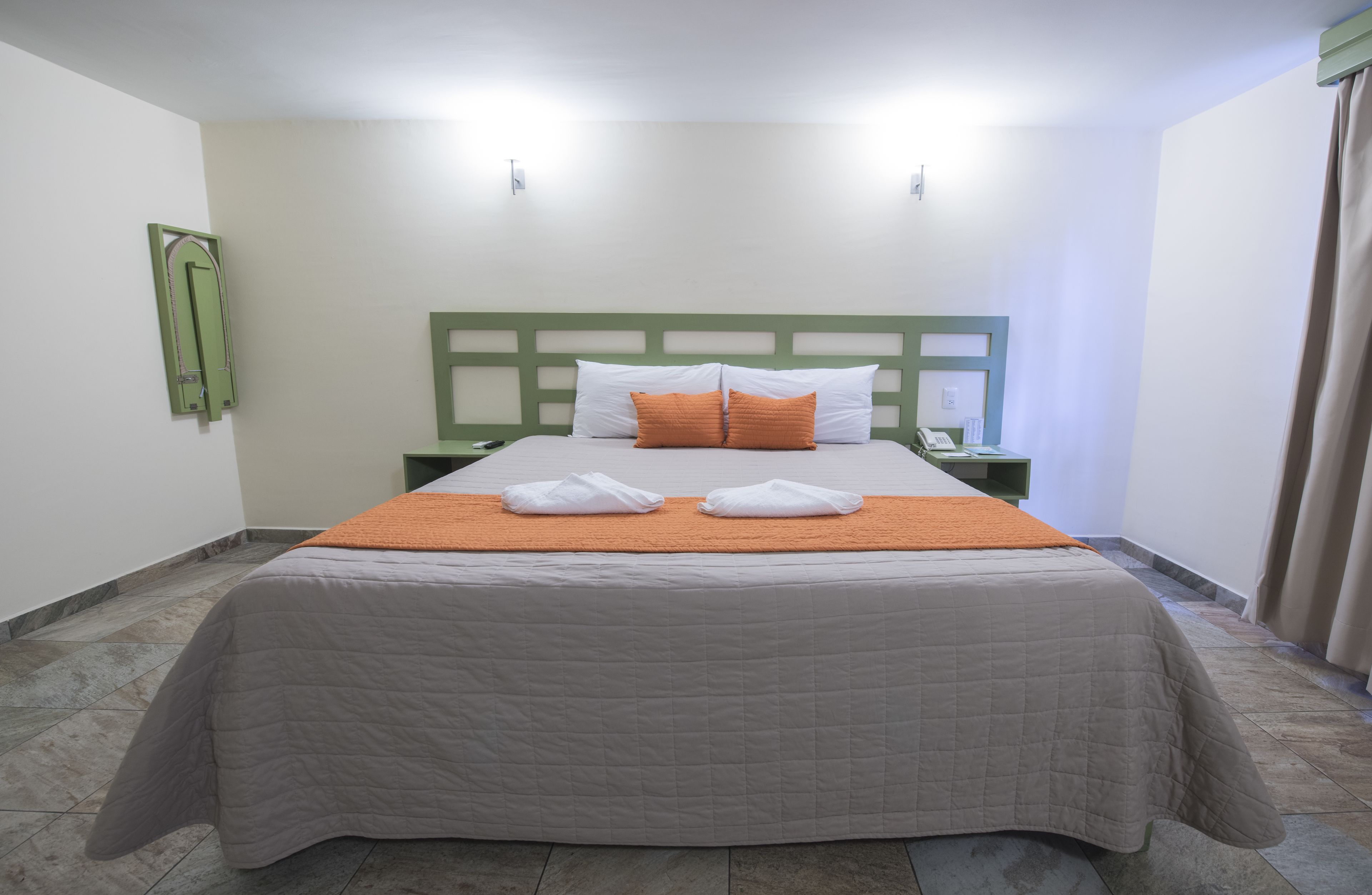 comfort room, 1 king bed, non smoking | premium bedding, in-room safe, desk, blackout curtains