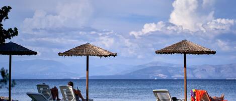 On the beach, beach shuttle, sun loungers, beach umbrellas