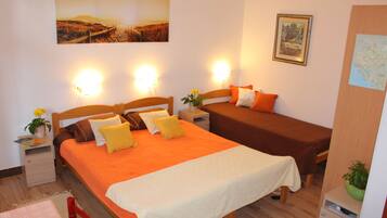 Classic Studio, Multiple Beds, Sea View | In-room safe, desk, iron/ironing board, cribs/infant beds