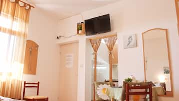 Classic Studio, Multiple Beds, Sea View | Living area | Flat-screen TV