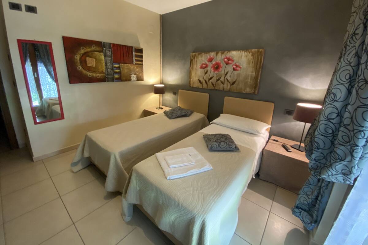Twin Room (Private External Bathroom) | Rollaway beds, free WiFi, bed sheets