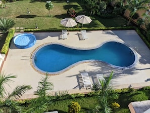 Outdoor pool, pool umbrellas, sun loungers