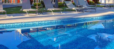 Outdoor pool, pool umbrellas, sun loungers