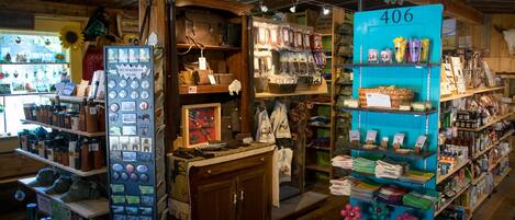 A store with wooden shelves, a blue display, and a sign with the number 406.