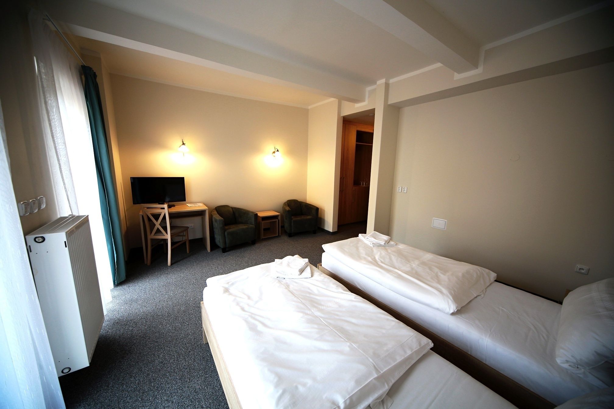 Hypo-allergenic bedding, minibar, desk, blackout curtains