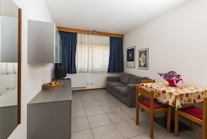 Apartment, 1 Bedroom | Living area | LCD TV