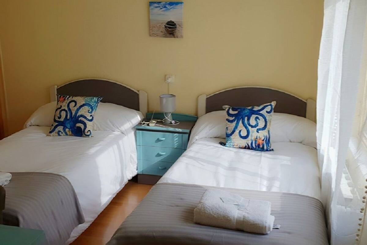 Twin Room, Private Bathroom | 7 bedrooms, blackout curtains, free WiFi, bed sheets