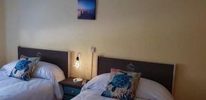 Twin Room, Shared Bathroom | 7 bedrooms, blackout curtains, free WiFi, bed sheets