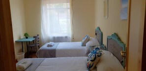 Twin Room, Shared Bathroom | 7 bedrooms, blackout curtains, free WiFi, bed sheets