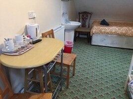 Economy Quadruple Room, Shared Bathroom | In-room safe, free WiFi, bed sheets