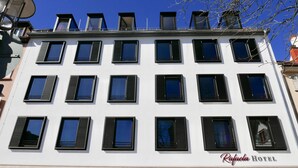 A white building with multiple windows and balconies, labeled "Rafaela Hotel." - Rafaela Hotel Heidelberg (Heidelberg)