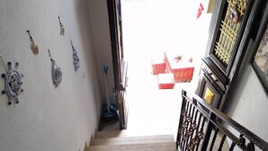 A staircase with a handrail leading to an outdoor area. - Halikarnas Butik Hotel (Adalar)