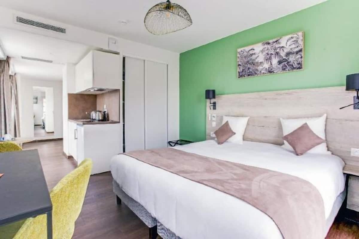 Premium bedding, desk, laptop workspace, soundproofing