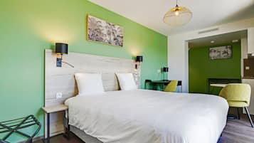 Premium bedding, desk, laptop workspace, soundproofing