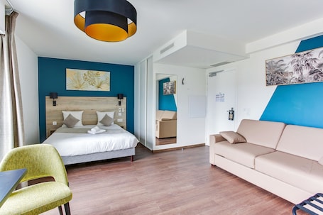 Premium bedding, desk, laptop workspace, soundproofing