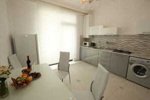 Fridge, microwave, stovetop, coffee/tea maker