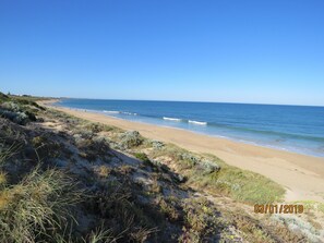 On the beach, sun loungers, beach towels