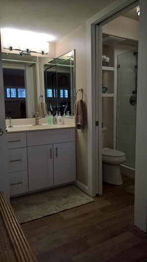 Shower, hair dryer, towels, toilet paper