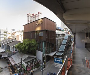 A modern building with a sign reading "Sukhon." - Sukhon Hotel (Bangkok)