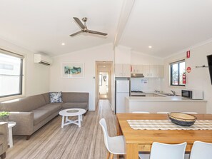 Deluxe Riverfront 3 Bedroom Villa - Not Pet Friendly | Living area | Flat-screen TV - Moruya Holiday Park (Moruya)