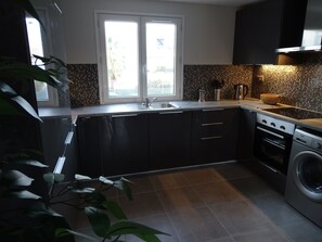 Fridge, microwave, oven, stovetop - Phare View - A contemporary apartment with view over the lagoon. (Marseillan)